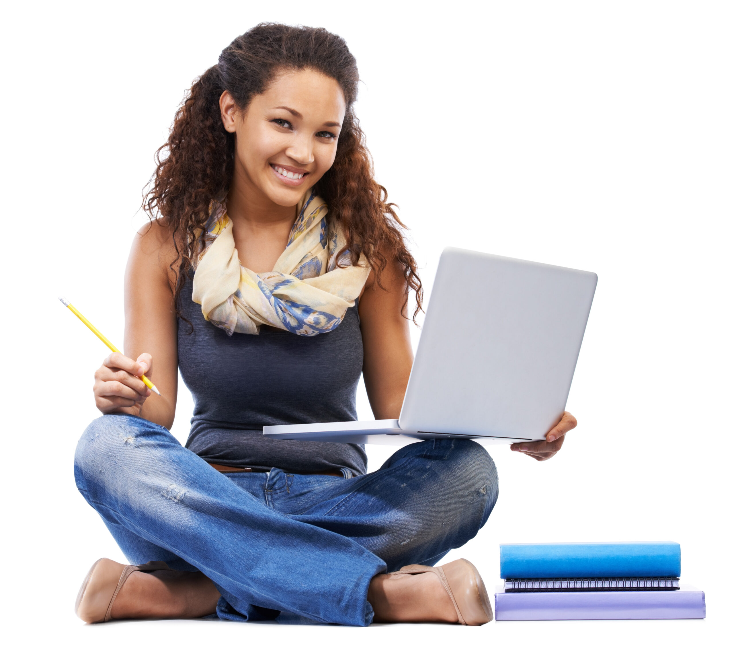 Shes a straight A student. Studio shot of a woman studying on a laptop isolated on white