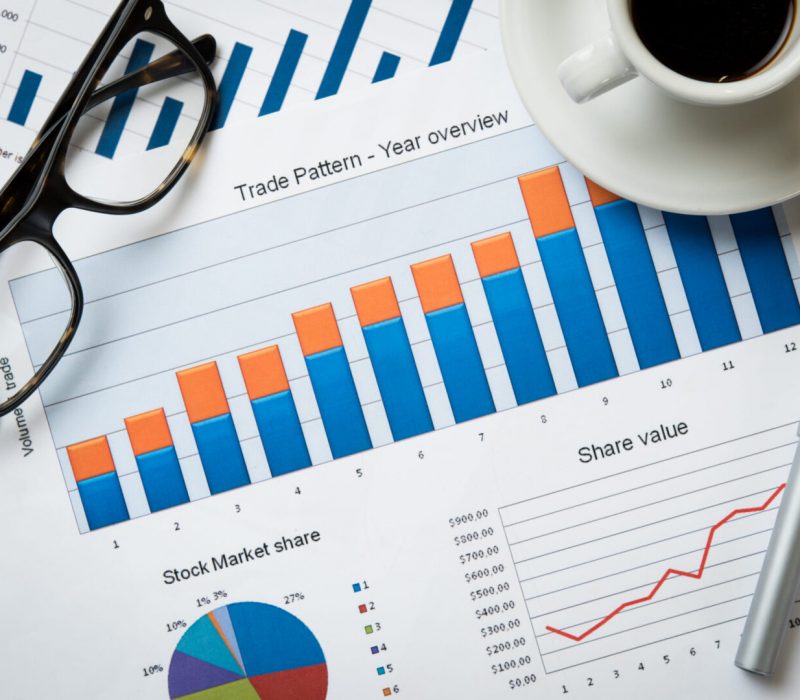 Close up of business document on office desk. Top view of business charts and graphs of stock market. Closeup of growing financial chart.